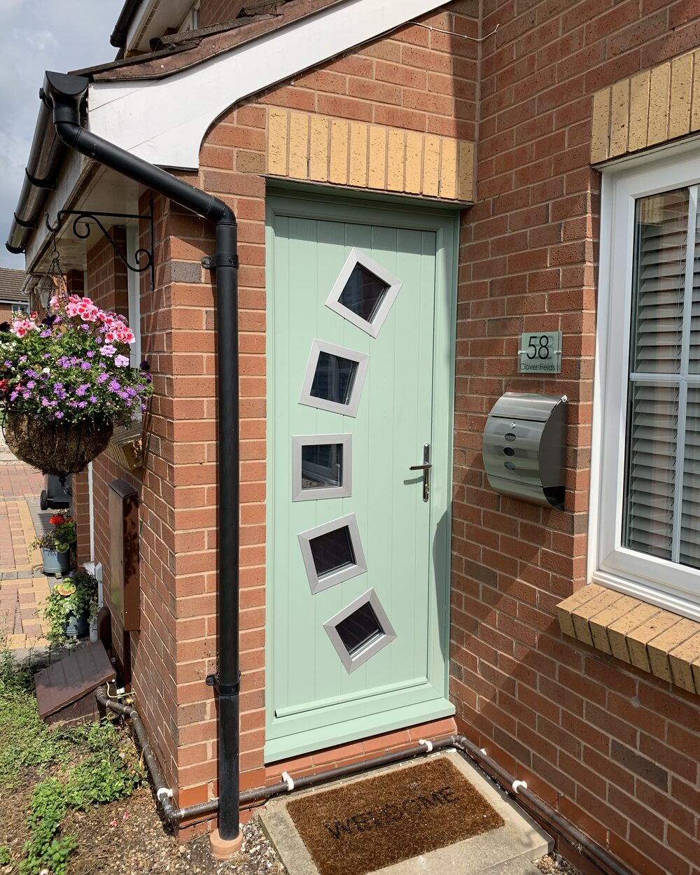 Premium anthracite grey composite front door fitted on a modern Nottingham home