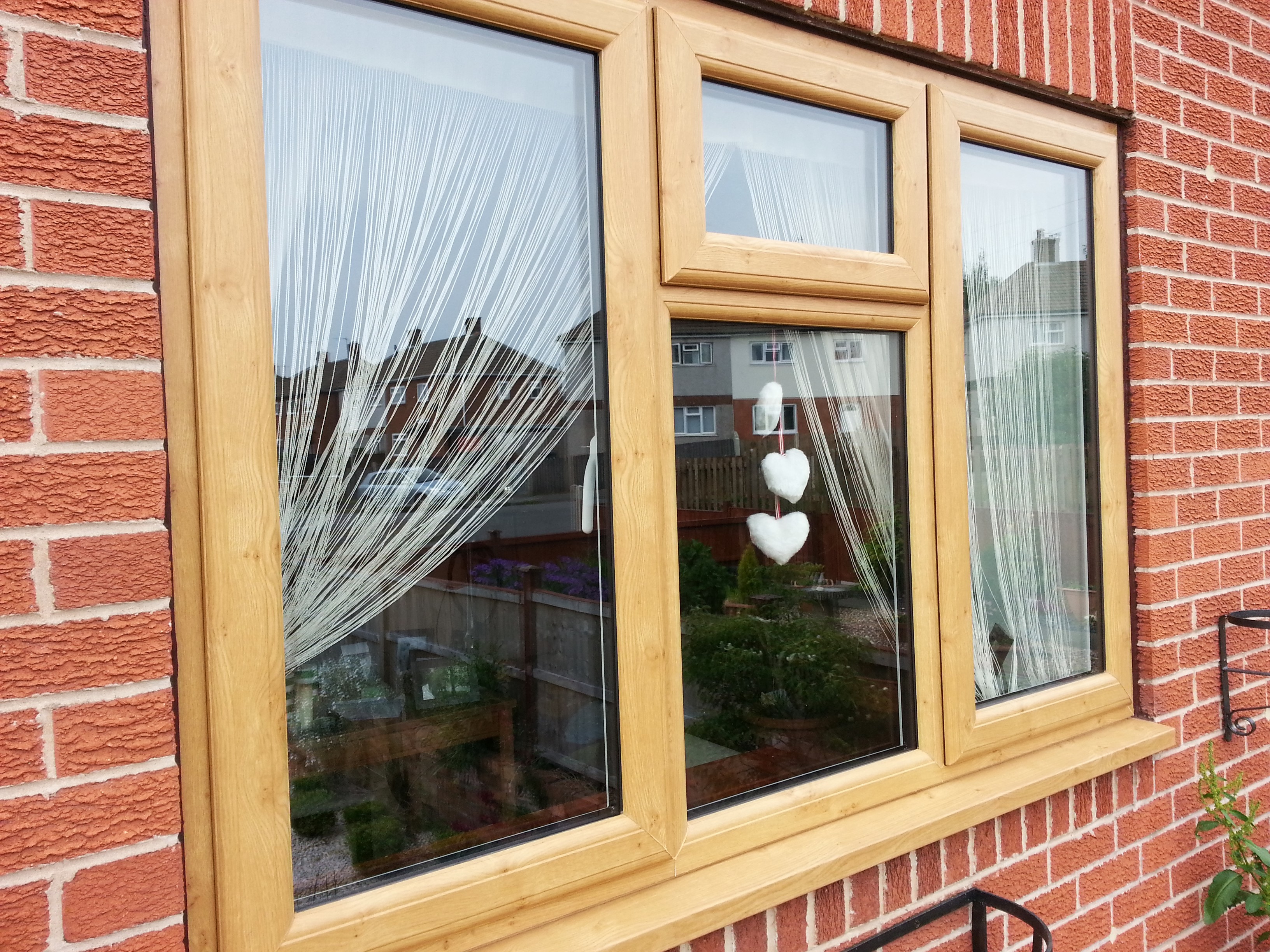 Golden oak uPVC bay window — Nottinghamshire