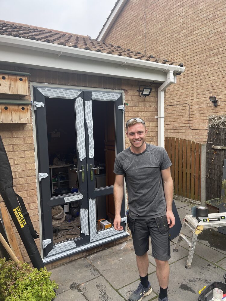 uPVC French doors being fitted by a Double Glazing Plus installer in Nottingham