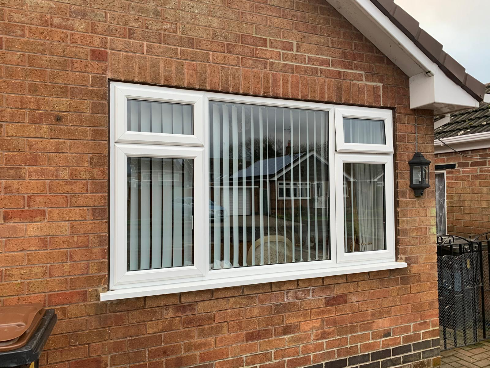 White uPVC casement windows installed on a brick home in Nottingham by Double Glazing Plus